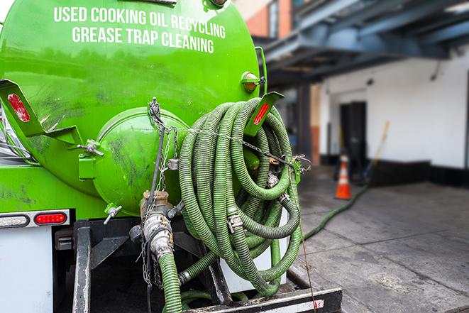 a large grease trap being pumped by a specialist in Bartlett TN